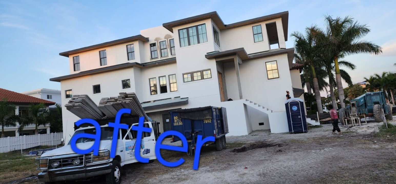 Finished exterior of three-story home in St. Petersburg, FL after new smooth stucco installation and painting — H Calix Stucco Design & Paint LLC.