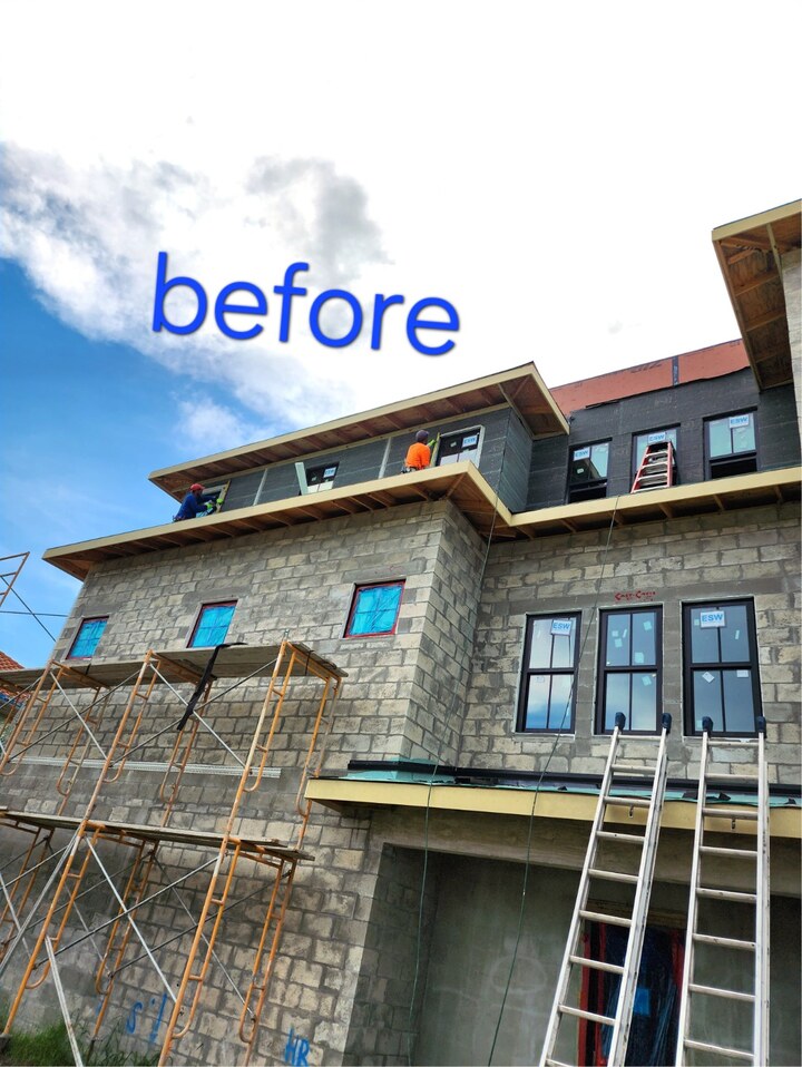 Modern home in St. Petersburg, FL before new smooth stucco installation — exposed concrete block walls with scaffolding by H Calix Stucco Design & Paint LLC.