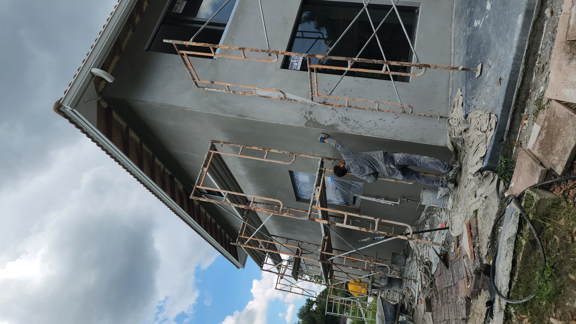 Stucco repair in progress — Tampa FL residential home with scaffolding