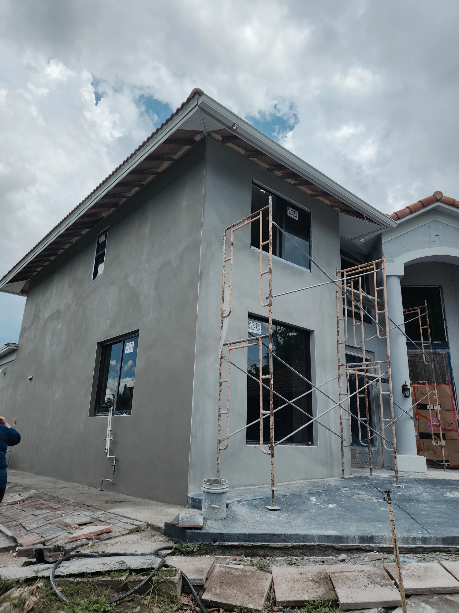 Completed stucco and paint work around sliding doors — Tampa FL residential