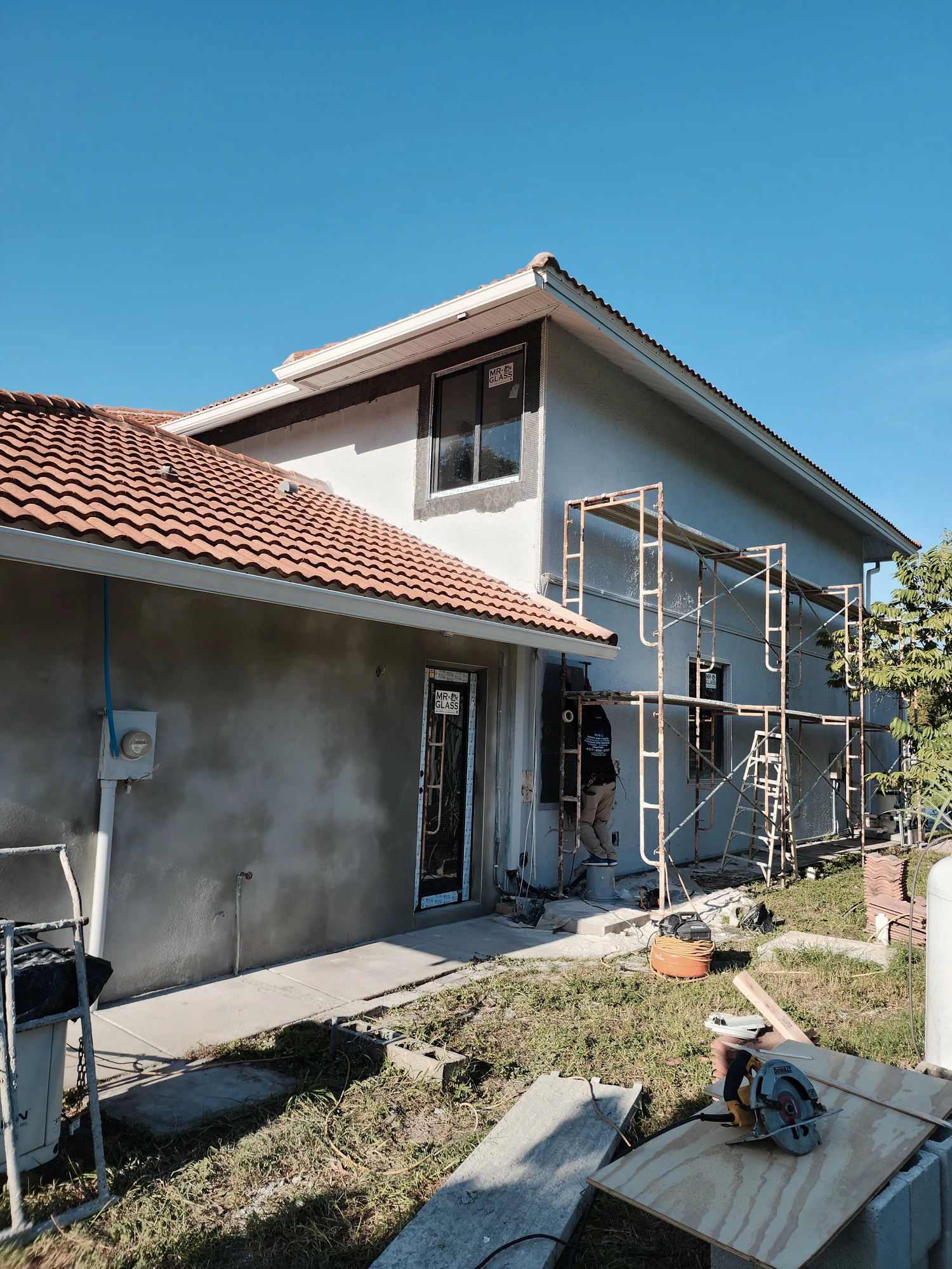 Technician applying stucco repair and texture matching in Tampa, FL