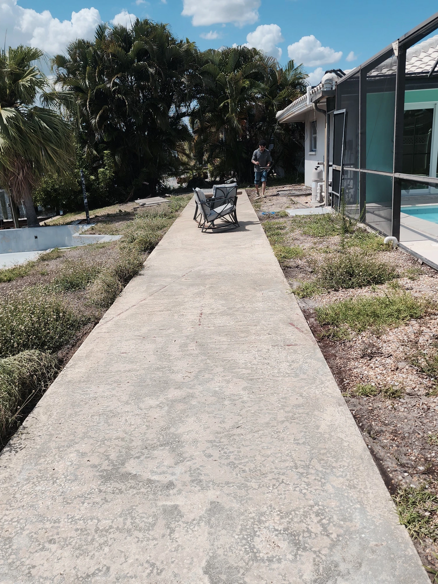 Freshly pressure-washed driveway restored to a clean, uniform appearance in Zephyrhills, FL — H Calix Stucco Design & Paint LLC.