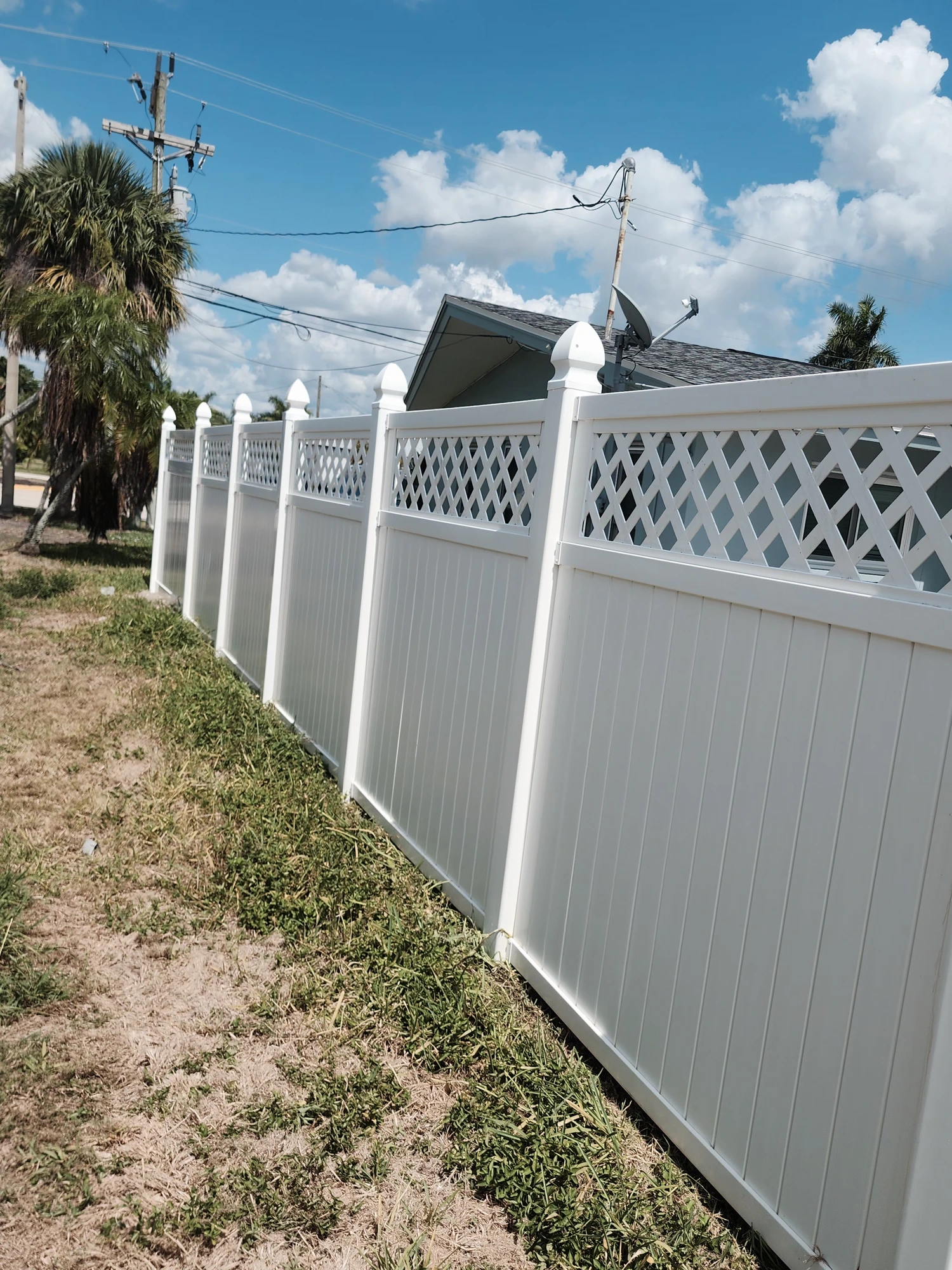 Clean, brightened concrete walkway after professional pressure washing in Zephyrhills, FL — H Calix Stucco Design & Paint LLC.